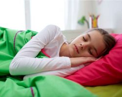 girl-sleeping-in-her-bed-at-home