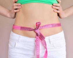 woman-measuring-waist-with-tape-on-knot-dieting