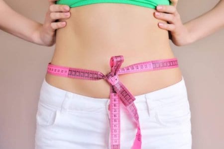 woman-measuring-waist-with-tape-on-knot-dieting
