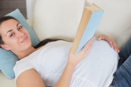 Preganant women reading book