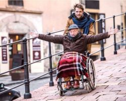 senior-father-in-wheelchair-and-young-son