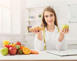 dietitian-nutritionist-with-bun-and-apple