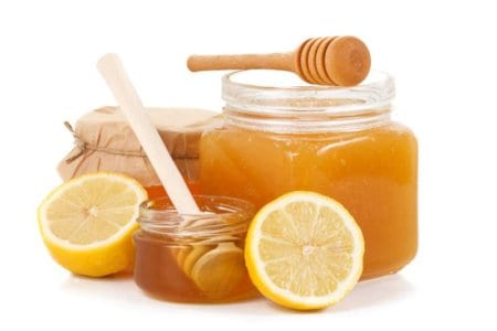 pot-of-honey-and-sliced-lemon