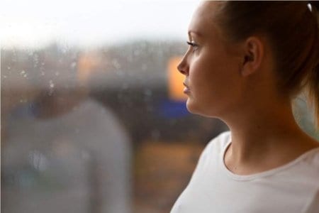 thoughtful-woman-looking-out-the-window