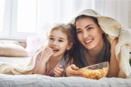 mother-and-daughter-eating-popcorn-