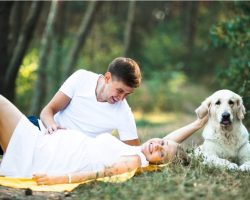 pregnant-woman-with-husband-lying-in-the-park