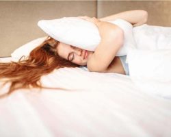 beautiful-woman-hugs-pillow-waking-up