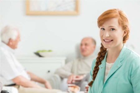 men-talking-behind-the-nurse