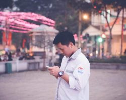 young men using mobile phone