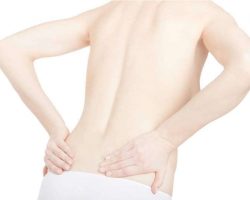 young-adult-woman-with-back-pain-isolated