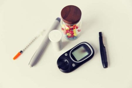 close-up-of-glucometer-insulin-pen-and-drug-pills