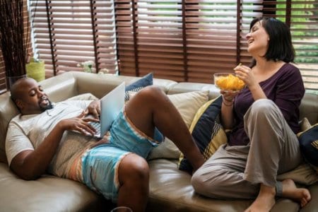 couple-watching-tv-on-the-sofa
