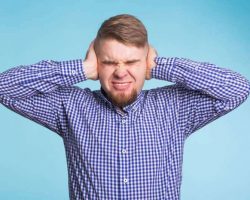 young-man-covering-his-ears