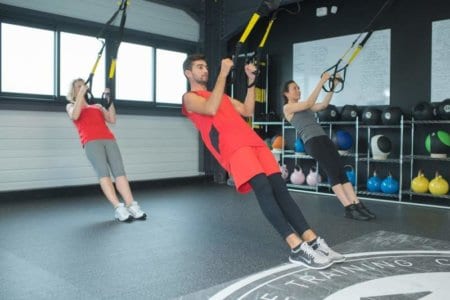 fit-young-people-training-hard-at-the-gym