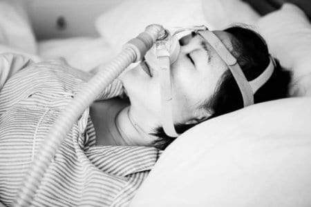 a-woman-wearing-anti-snoring-chin-straps