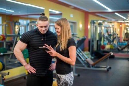 fit-attractive-young-couple-at-a-gym-looking