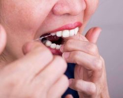 series-of-asian-woman-flossing-teeth-with-oral