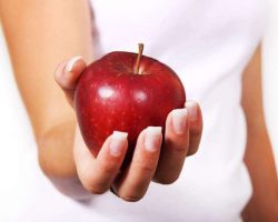 women holding apple