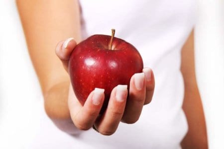 women holding apple