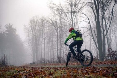 mountain-biker-cycling-on-trail-in-woods