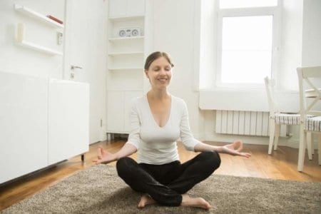 portrait-of-an-attractive-woman-sitting-in-lotus