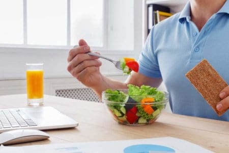 unrecognizable-man-has-healthy-business-lunch