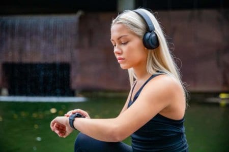 sporty-female-runner-listening-music