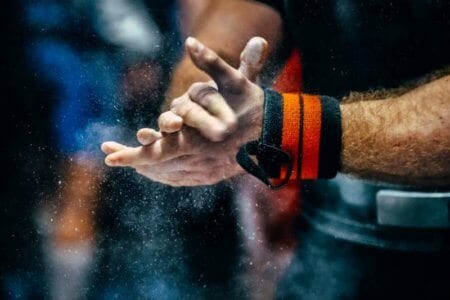 male-powerlifter-hand-in-talc-and-sports