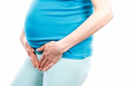 pregnant-woman-with-hands-on-her-stomach