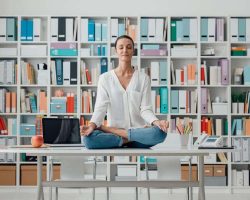 woman-practicing-meditation-on-a-desk