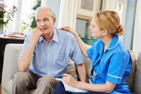 community-nurse-visits-senior-man-suffering
