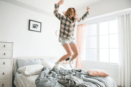 Young happy women jumping