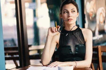 elegant-young-woman-took-off-her-glasses-while