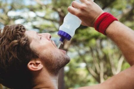 close-up-of-man-drinking-water