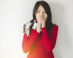 asian-woman-coughing-with-sore-throat