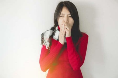 asian-woman-coughing-with-sore-throat